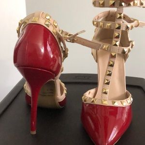 Red pointed toe studded heel